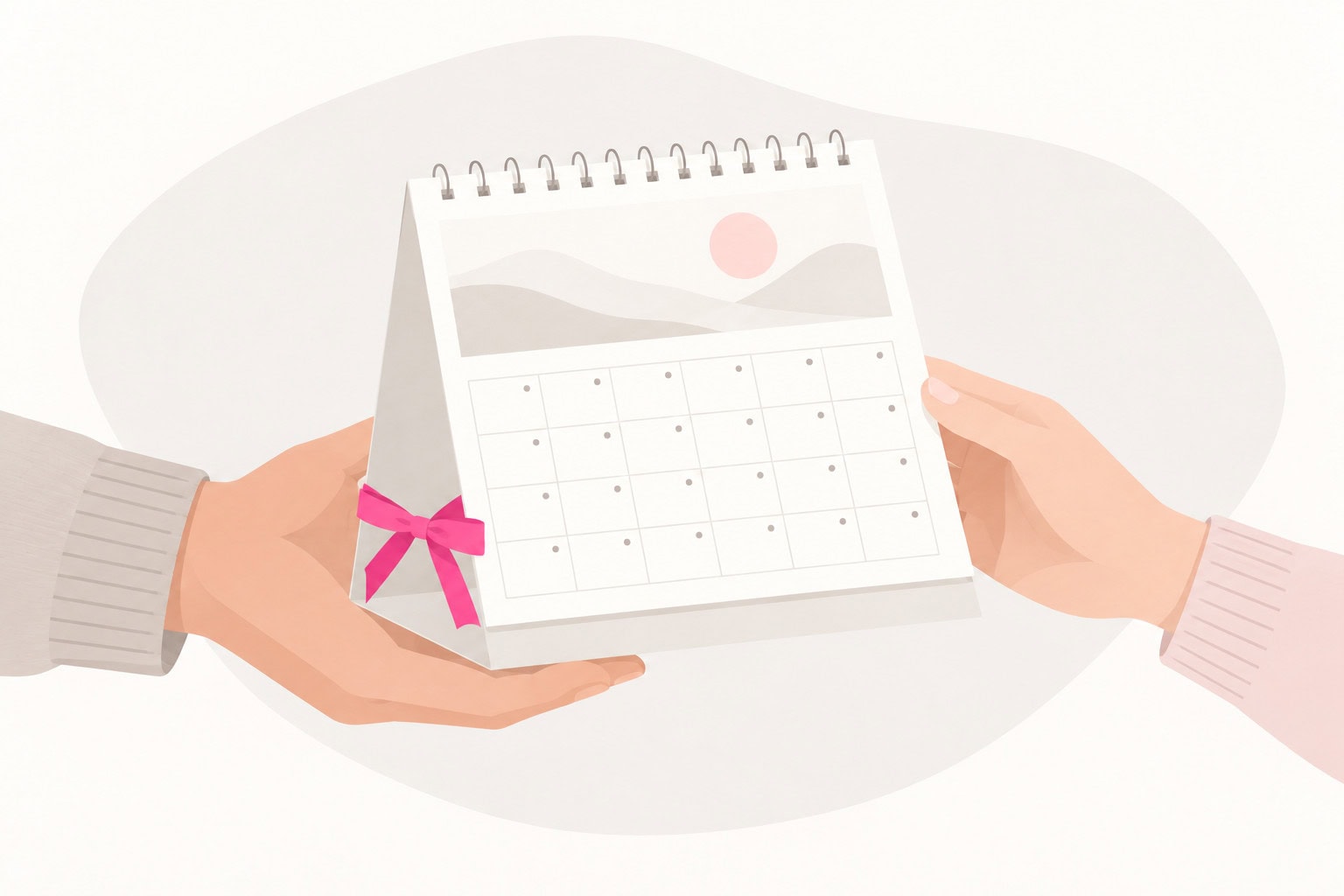 Zwei Hände mit unterschiedlichen Pullovern überreichen einen Tischkalender mit pinker Geschenkschleife.
